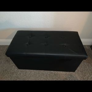 Black pleather collapsible storage ottoman